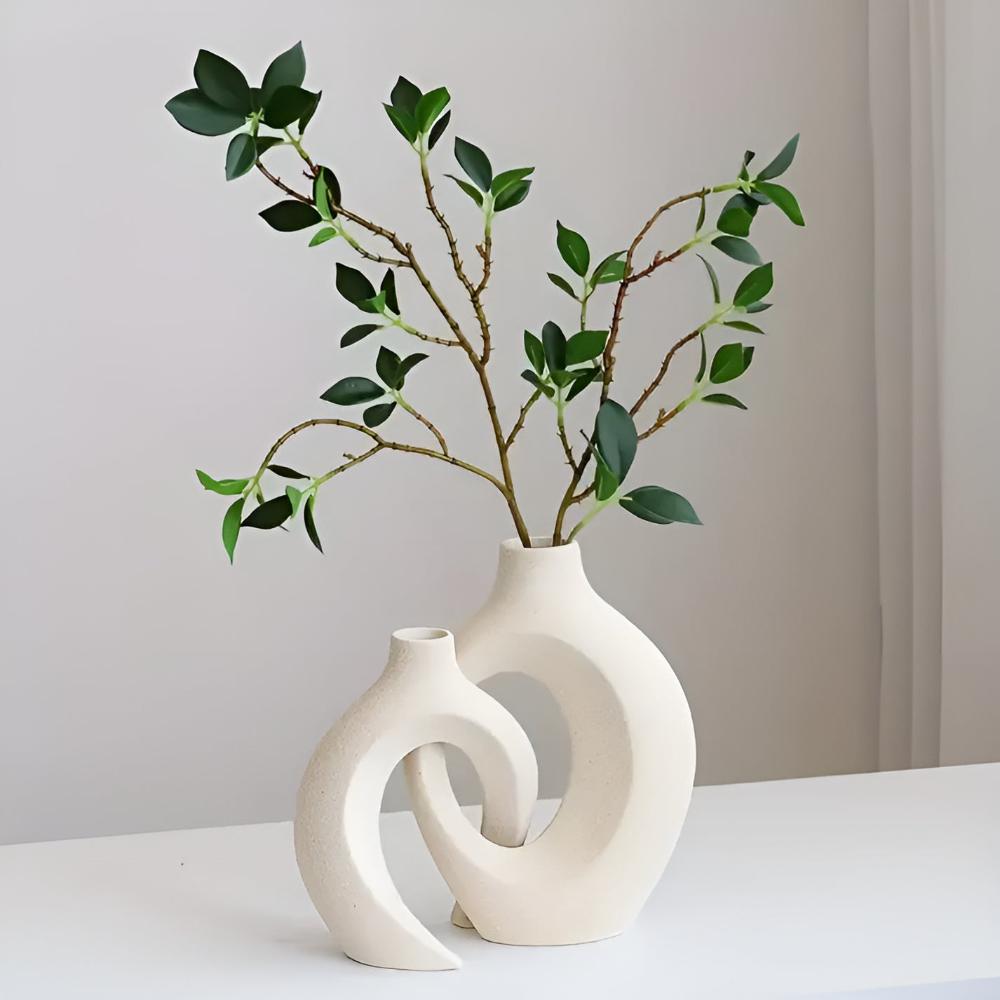 Duo of matte ceramic vases, intertwined abstract shapes