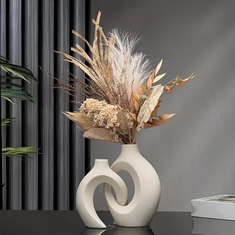 Duo of matte ceramic vases, intertwined abstract shapes