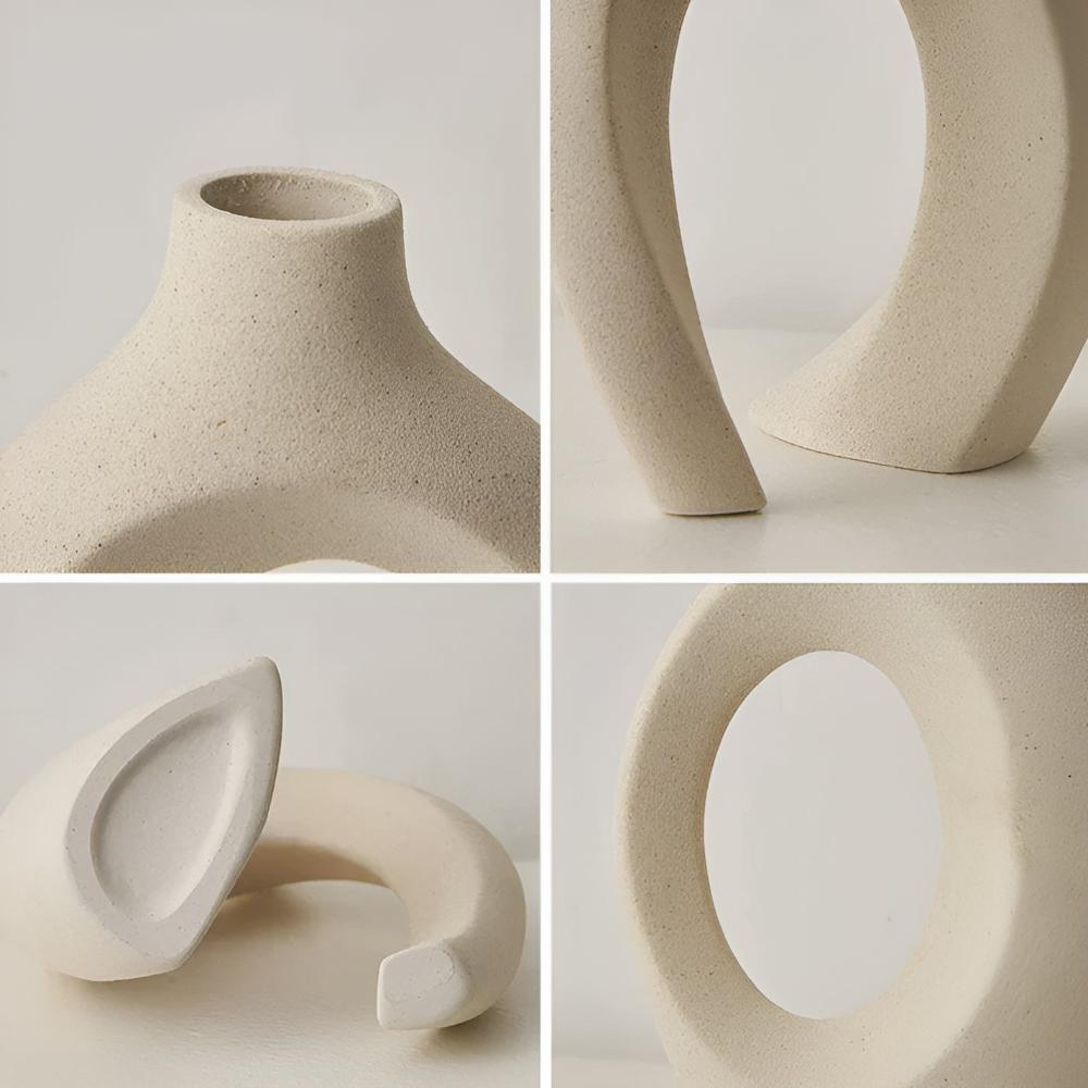 Duo of matte ceramic vases, intertwined abstract shapes