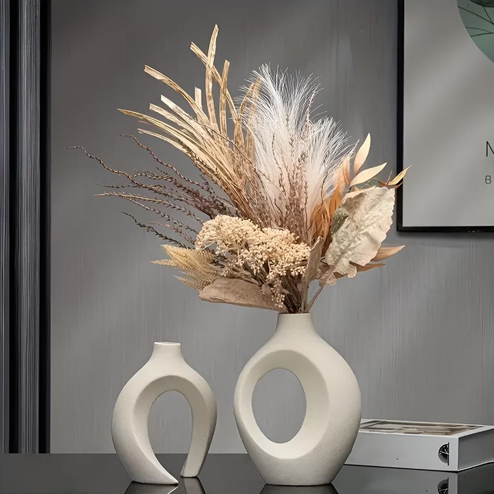 Duo of matte ceramic vases, intertwined abstract shapes